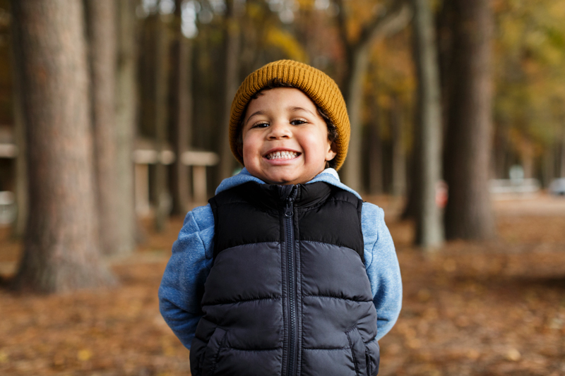 Smiling child wearing a beanie 